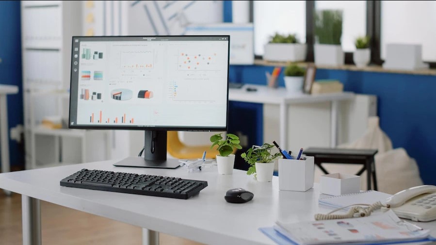 a desktop on a table is placed in an office