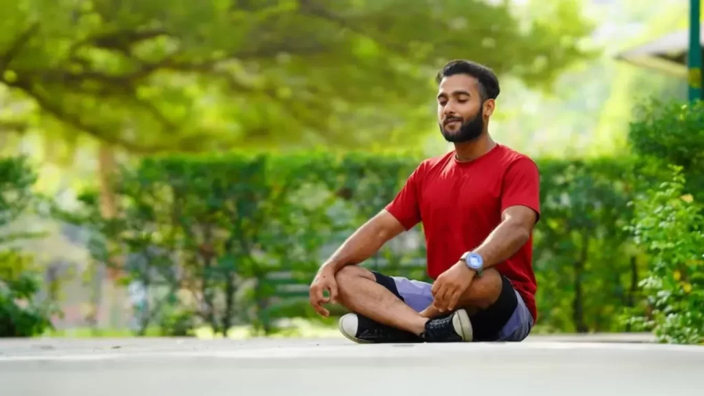 a man doing yoga at home