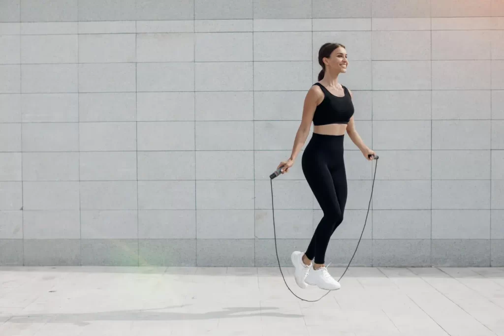 young woman doing jump rope cardio