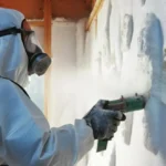 A Man Doing Spray Foam Insulation