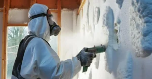 A Man Doing Spray Foam Insulation